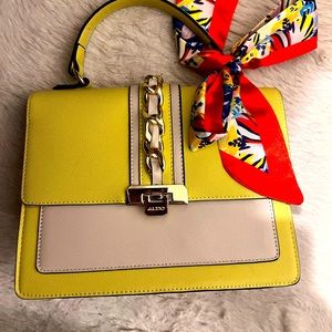 Aldo lime and white color woman’s handbag with colorful scarf.